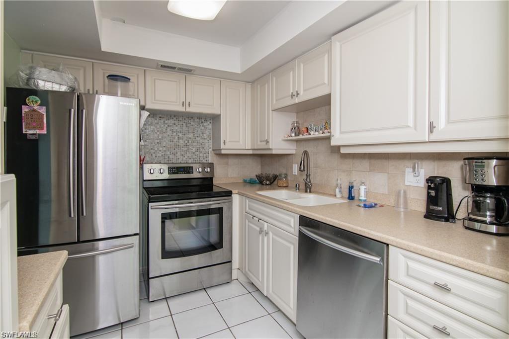 Well-equipped kitchen with stainless steel appliances, generous cabinetry, and workspace.
