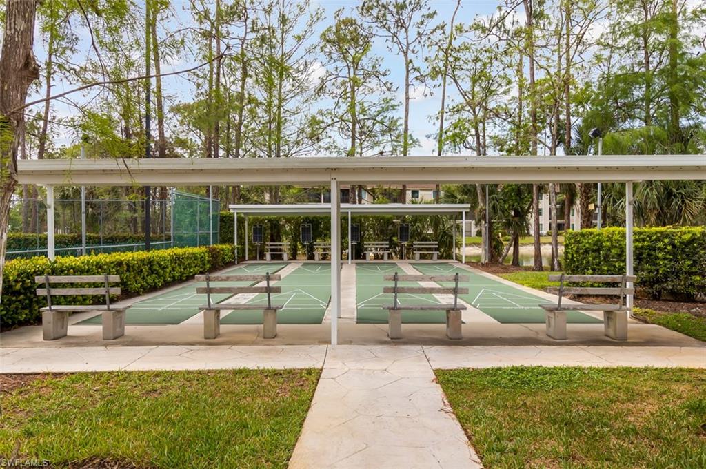 View of property's community featuring shuffleboard