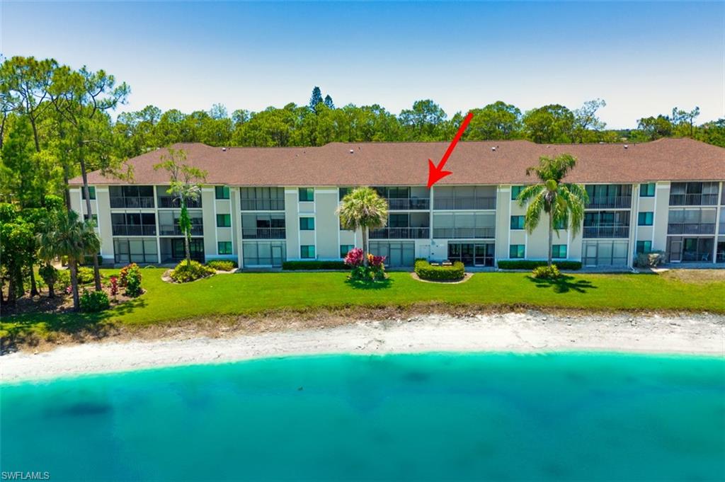 View of property with a water view