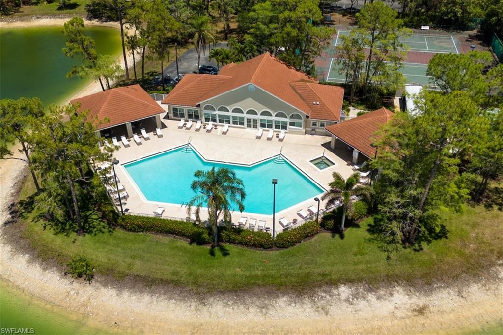 View from above of property featuring a pool area and a large body of water