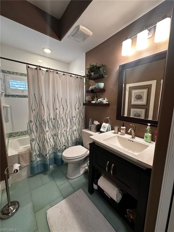 Bathroom with vanity, shower / bathtub combination with curtain, toilet, tile patterned flooring, and visible vents