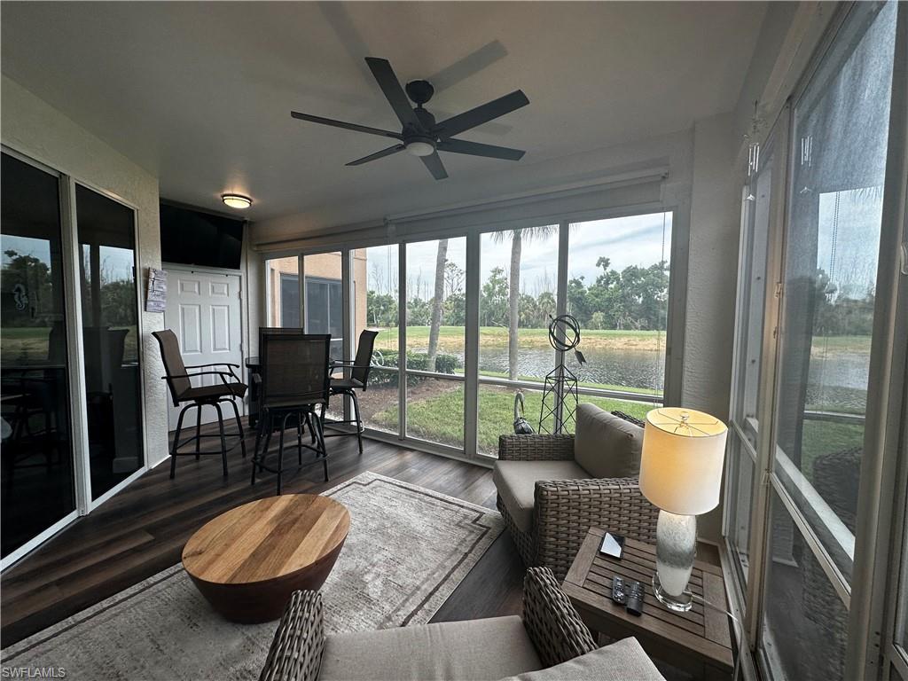 Sunroom / solarium with a ceiling fan
