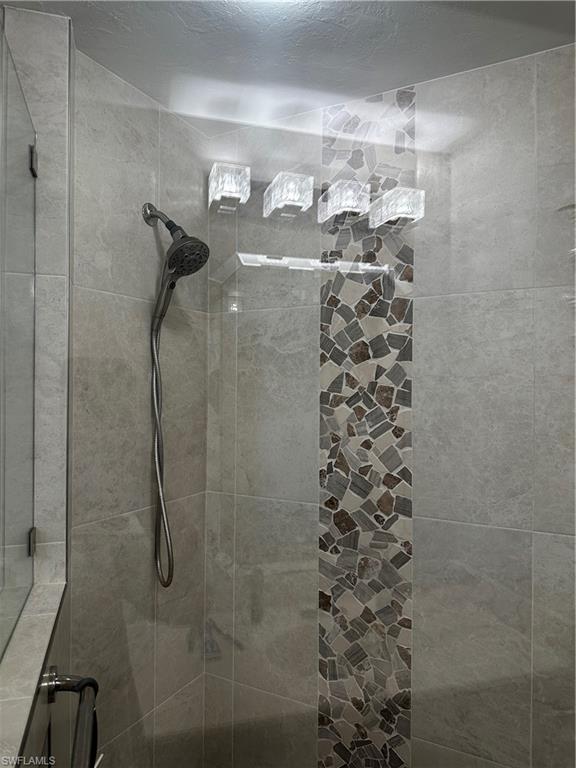 Full bath with tiled shower