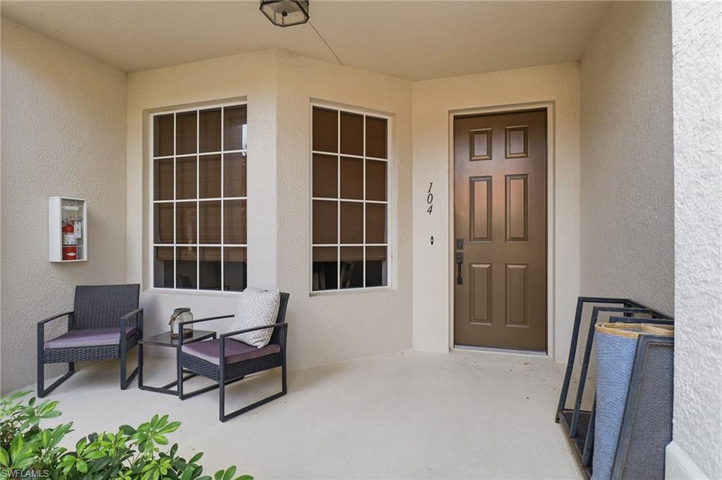 Entrance to property featuring stucco siding
