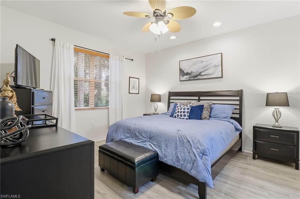 Primary Bedroom with light wood-style floors, recessed lighting, and ceiling fan