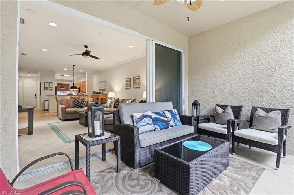 View of patio / terrace with a ceiling fan and an outdoor living space