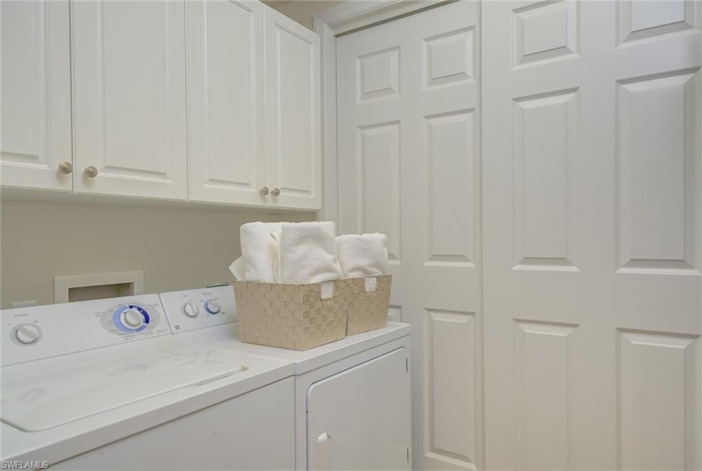 Plenty of storage in laundry room next to hallway bathroom and front bedroom