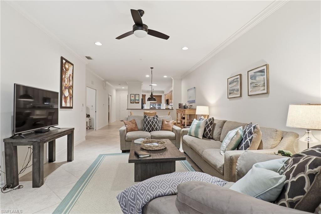 Living area featuring crown molding, recessed lighting, a ceiling fan, and tile patterned flooring