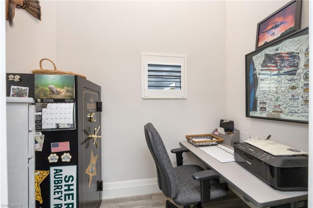 Laundry room has been converted to a small office.