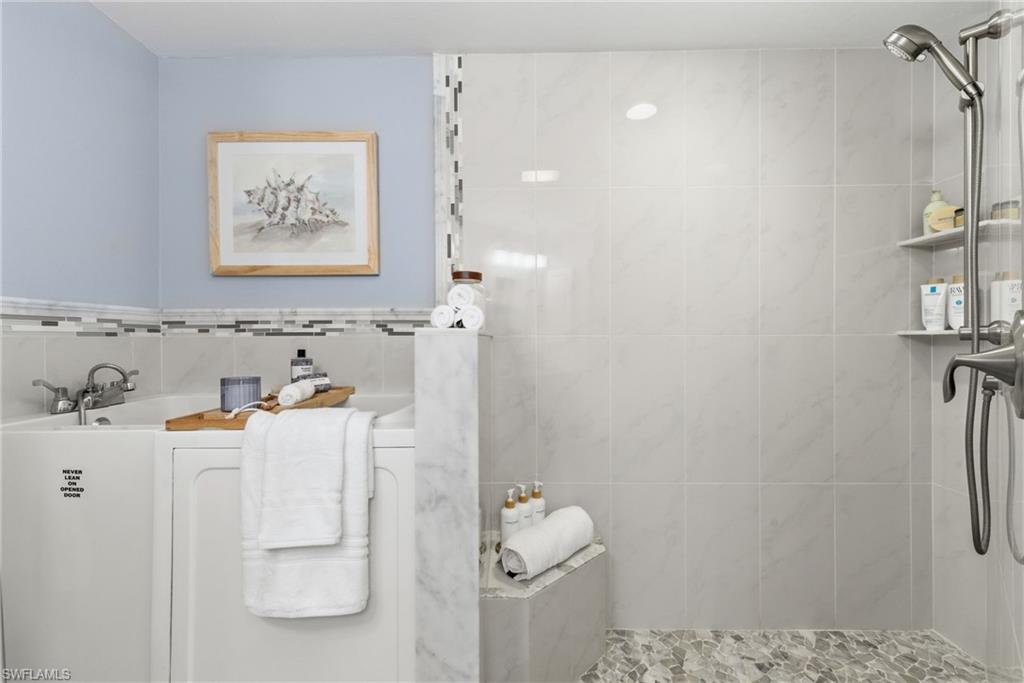 Master bath includes a therapeutic spa tub and walk in shower