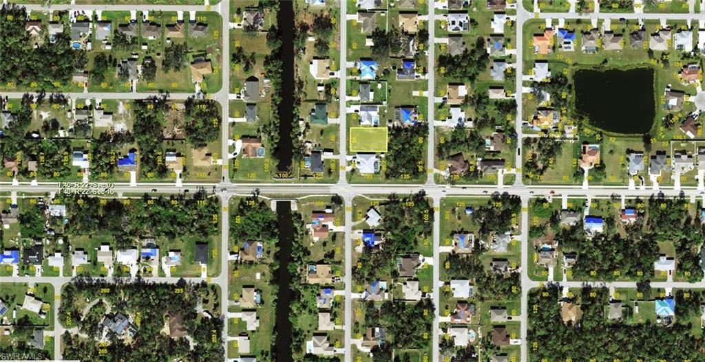 Aerial Property Map. Illustrating the property's location within a residential area, including surrounding structures and waterways