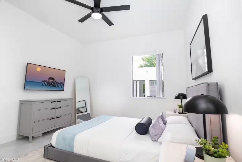 Bedroom with a swimming pool view