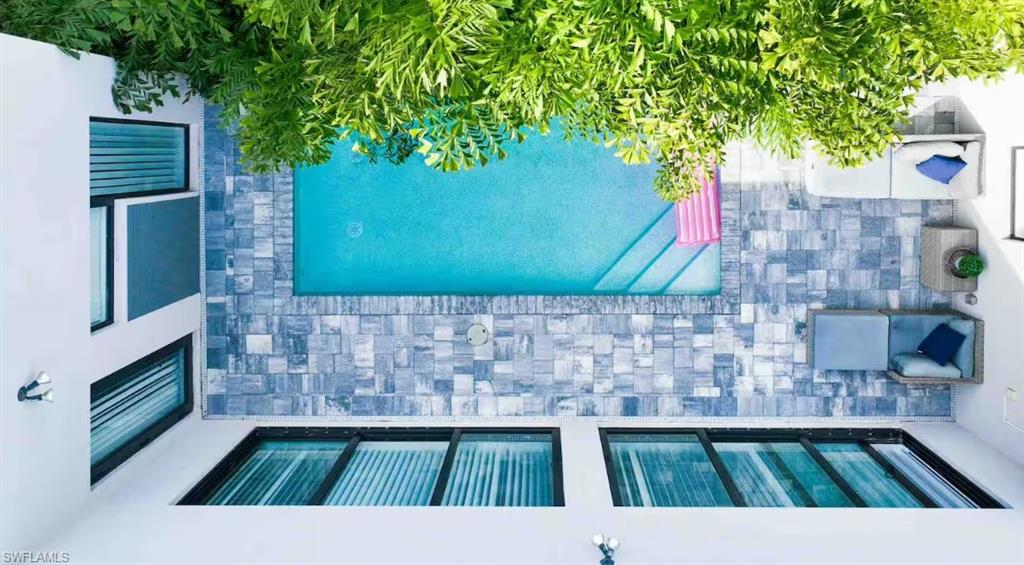 Outdoor pool with stone paver