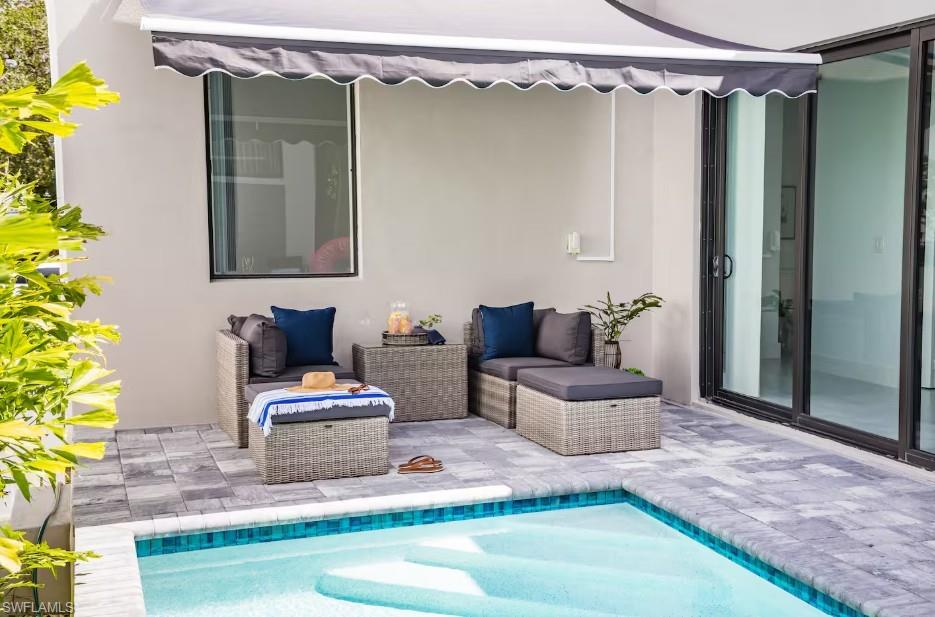 Patio with a swimming pool view