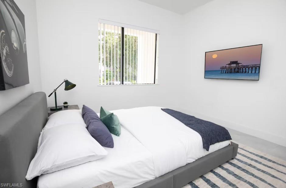 Bedroom with a front yard view