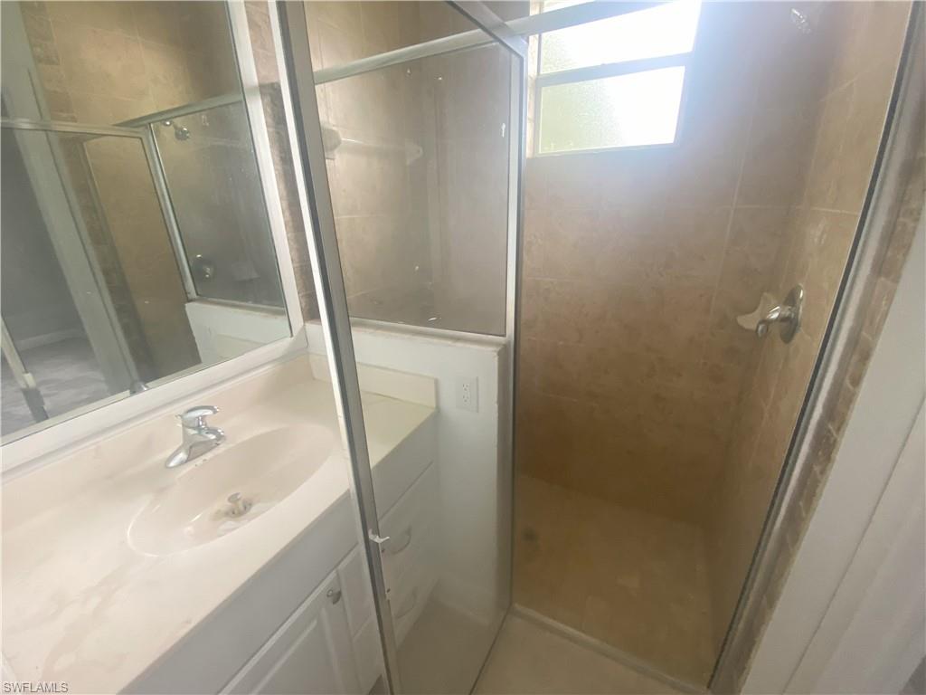 Bathroom vanity with an integrated sink and chrome faucet