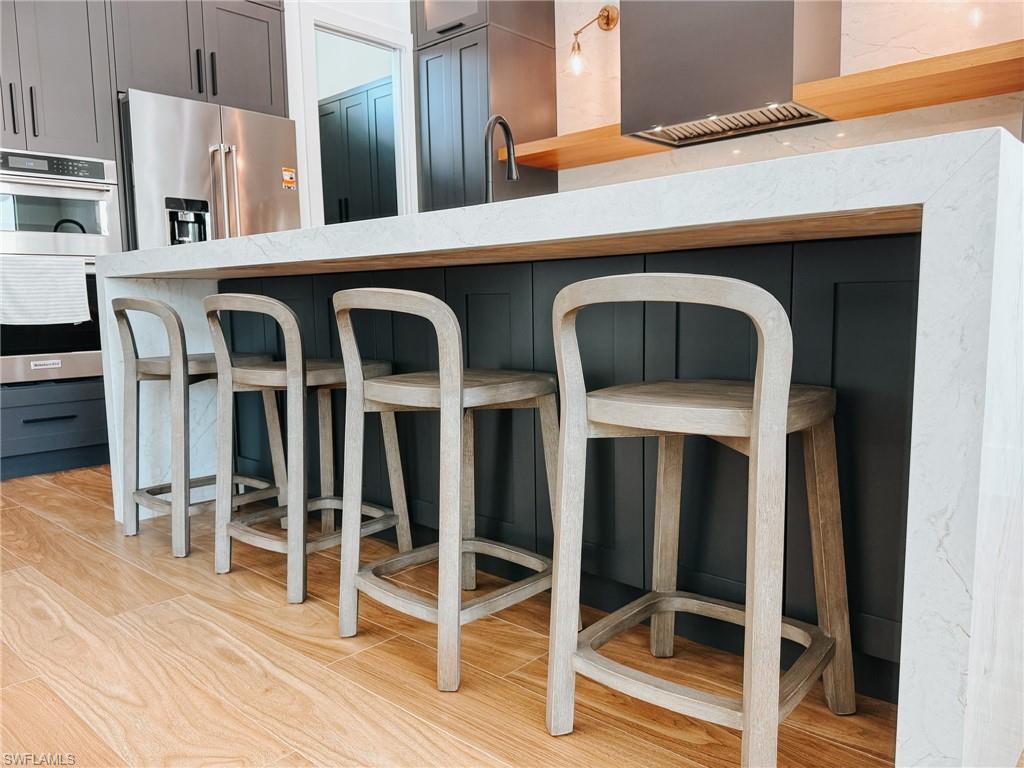 Large Kitchen Island with Mitered Edge and Waterfall Feature, Under-Island Storage Cabinets