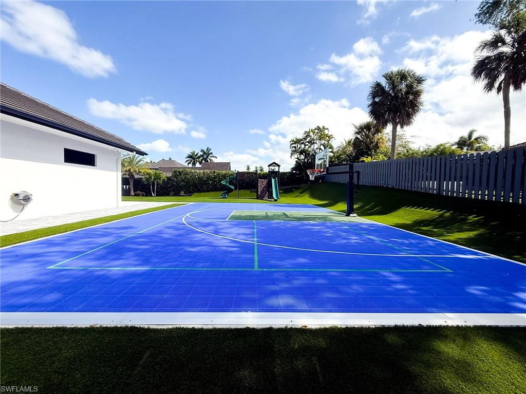 Outdoor multi-sport court with vibrant blue surfacing