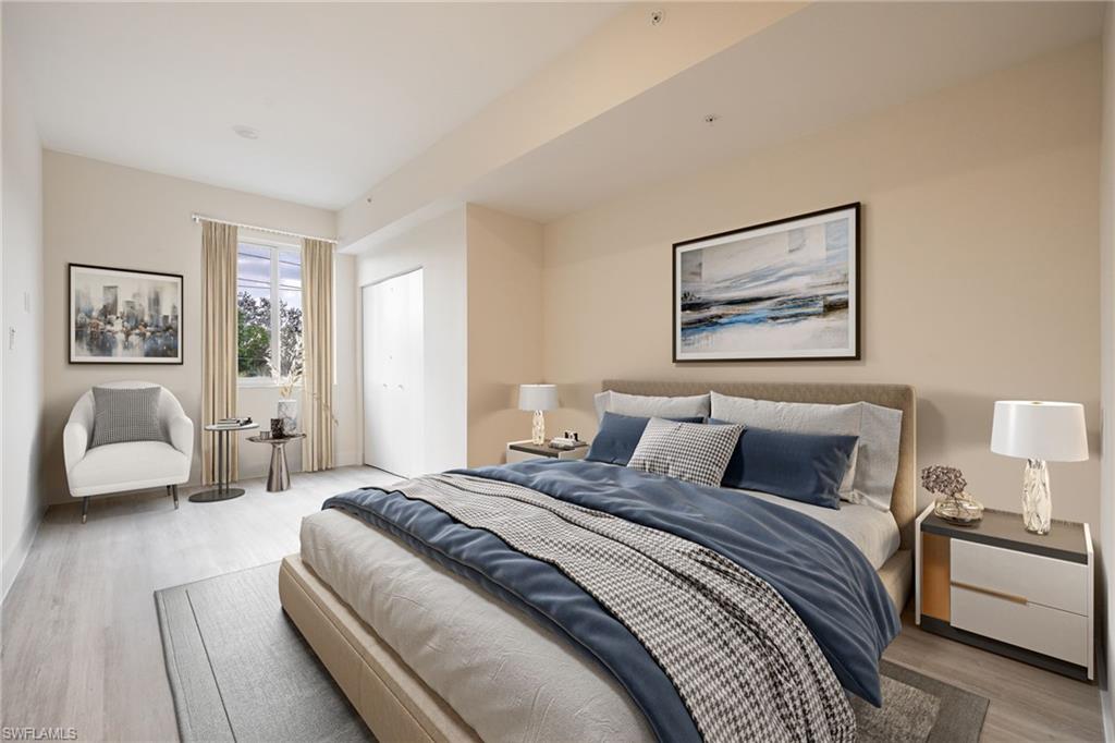 Bedroom with baseboards and wood finished floors