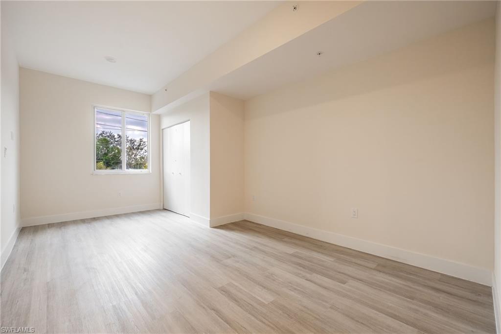 Spare room with light wood finished floors and baseboards