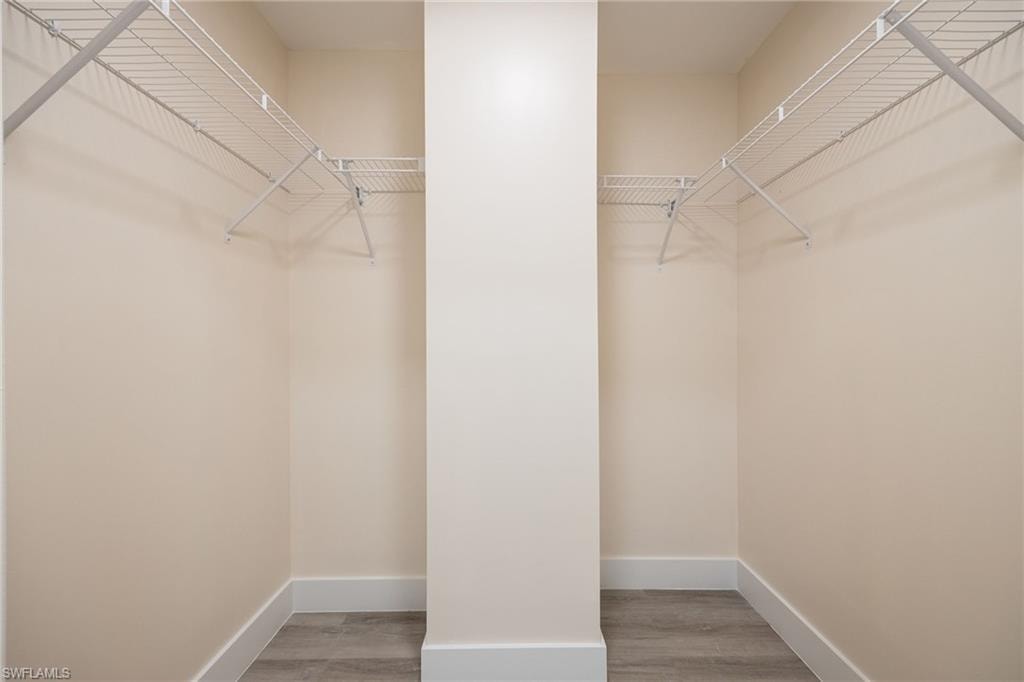 Spacious closet with wood finished floors