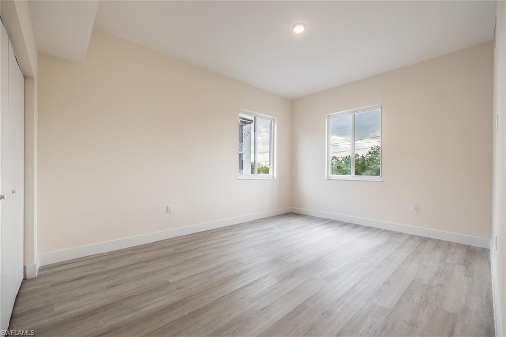 Spare room with recessed lighting, baseboards, and light wood-style flooring