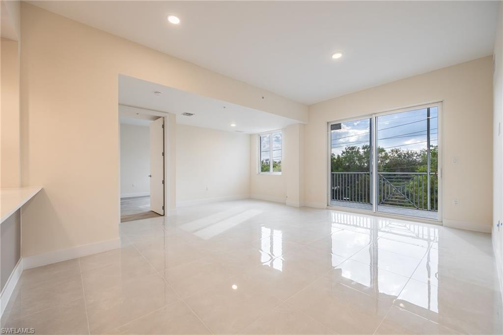 Unfurnished room featuring baseboards, recessed lighting, and light tile patterned floors