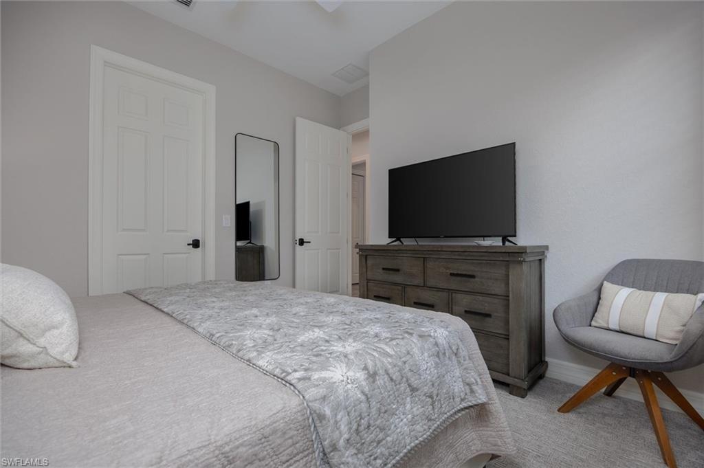 Neutral tone walls with white trim and carpeting