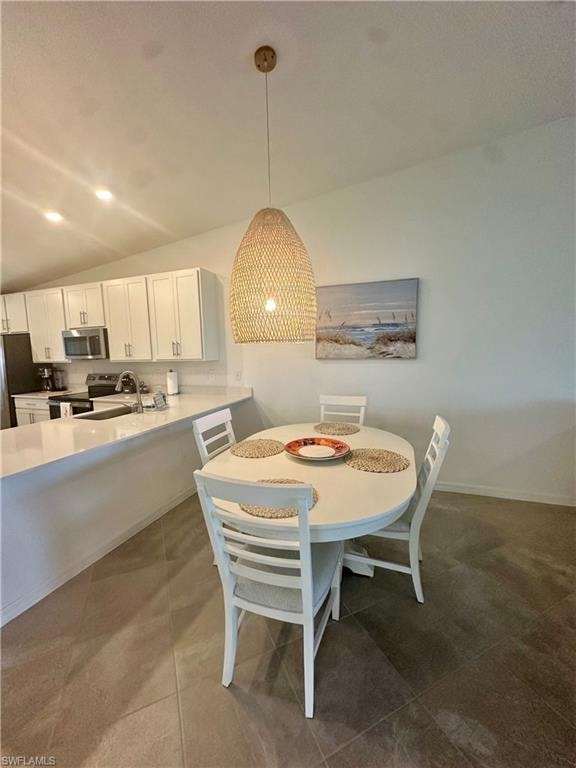 Dining room with vaulted ceiling