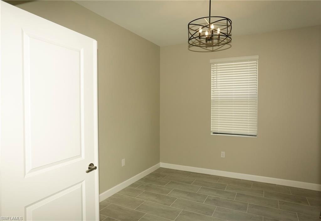 Neutral tone walls and wood-finish tile flooring