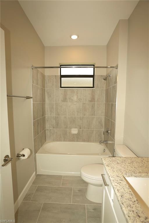 Bathroom featuring a white bathtub, tiled shower surround, recessed ceiling light, frosted window, and a granite-look countertop