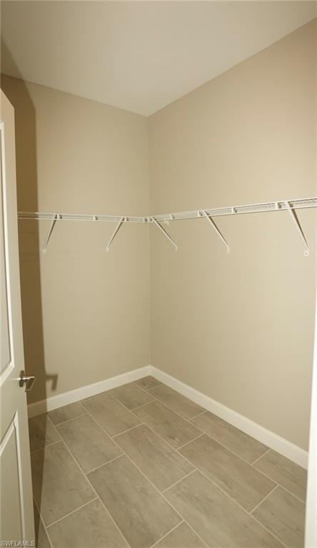 Neutral-toned walls and wood-look tile flooring