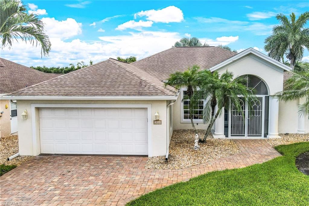 Ranch-style home featuring a garage