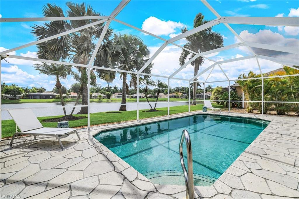 View of pool with a yard, a lanai, and a patio area