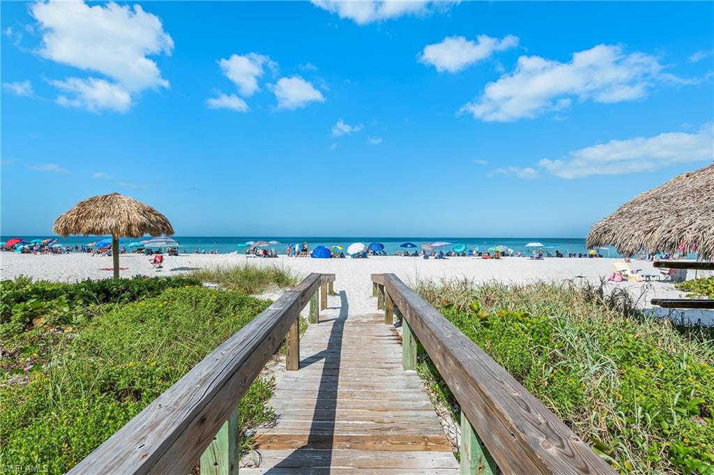 View of nearby features featuring a beach view and a water view