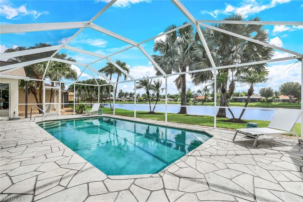 View of swimming pool with a patio and a lanai