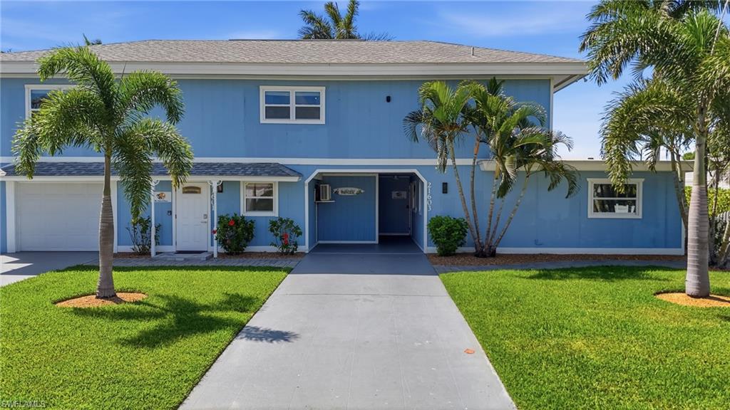 Blue two-story exterior with white trim - Virtually Edited Image
