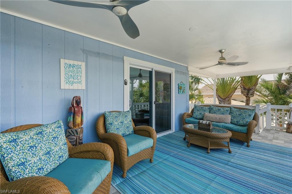 Covered outdoor patio featuring light blue vertical paneling - Virtually Edited Image