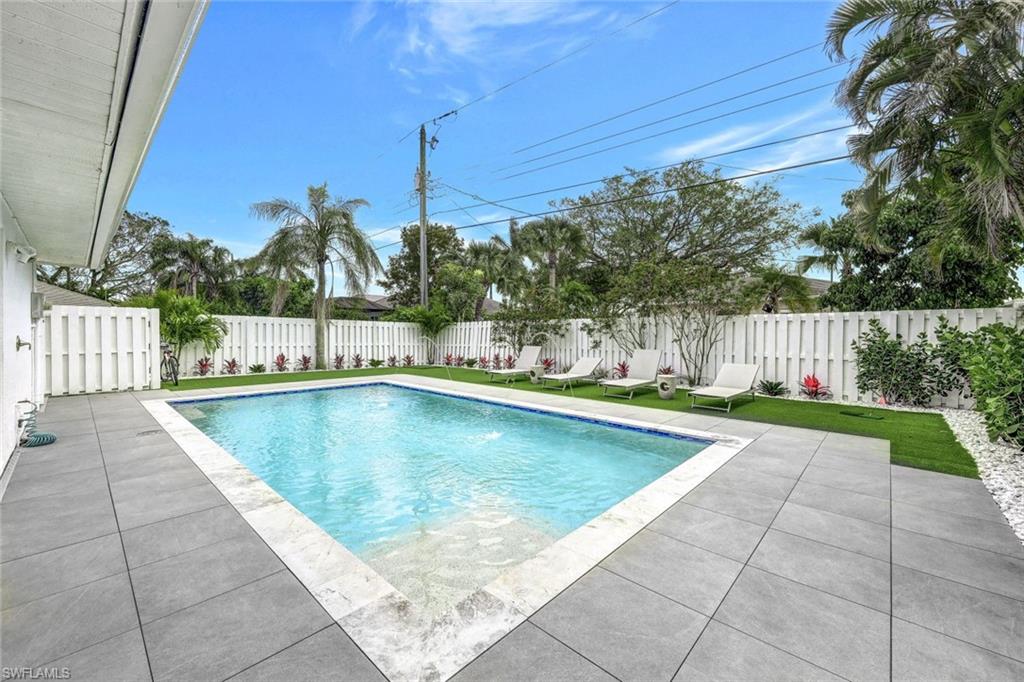 Private backyard with sparkling pool