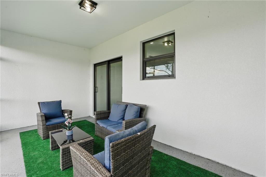 View of patio with an outdoor living space