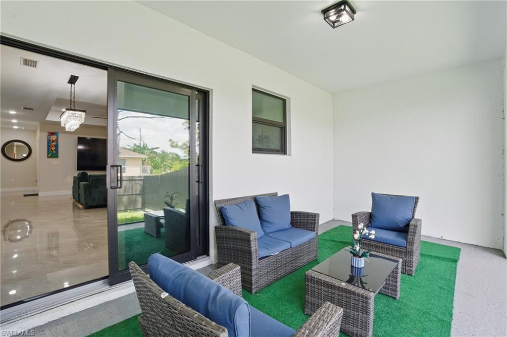View of patio featuring an outdoor hangout area