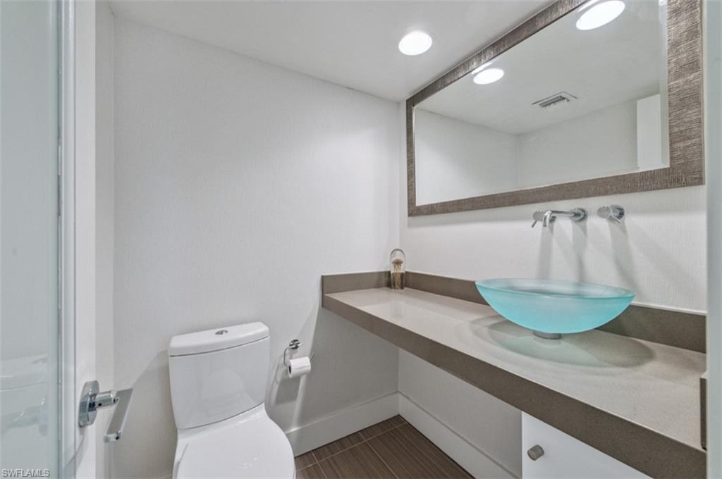 Half Bathroom featuring tile patterned floors