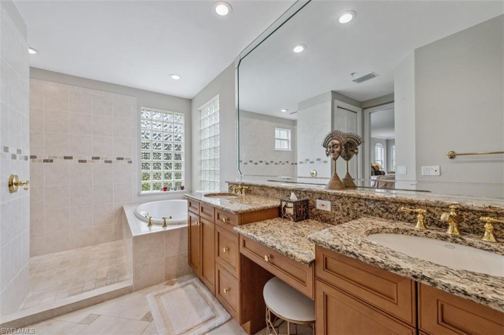 Full bath featuring a walk in shower and tub
