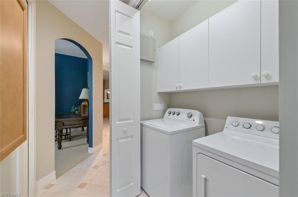 Laundry with washing machine and dryer and cabinet space