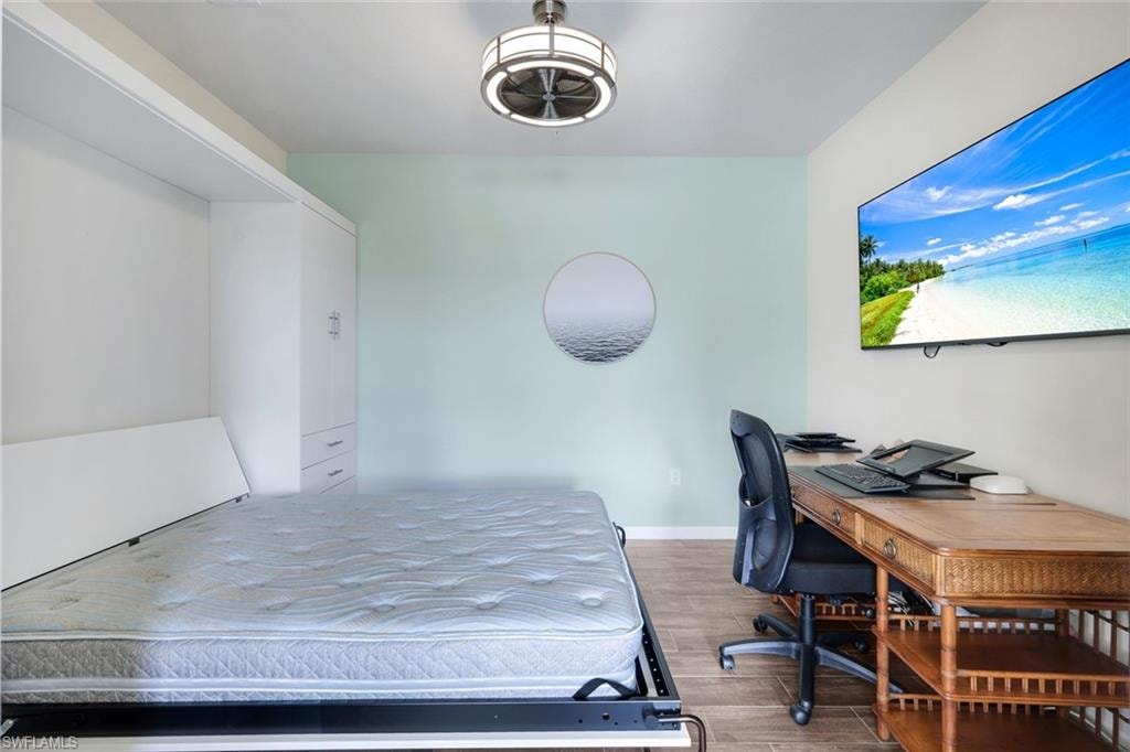 Den space that has custom built in Murphy Bed.