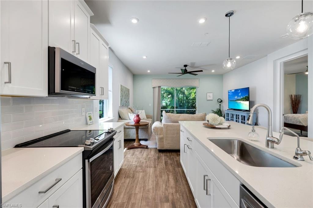 Stainless appliance package and pendant lighting