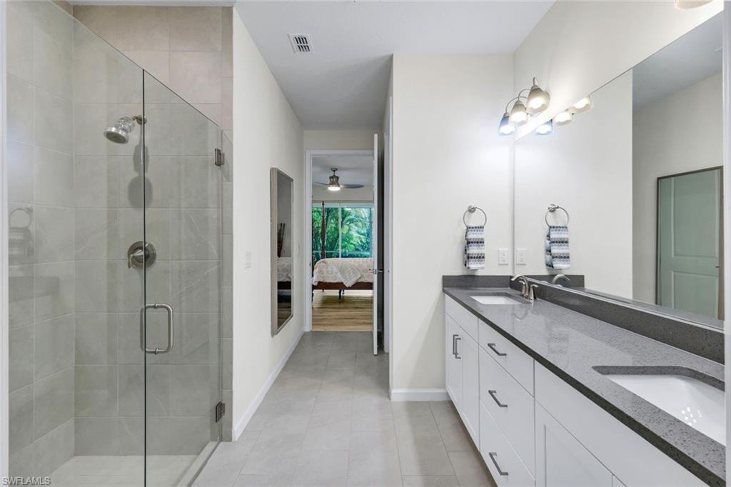 Frameless shower and dual sinks