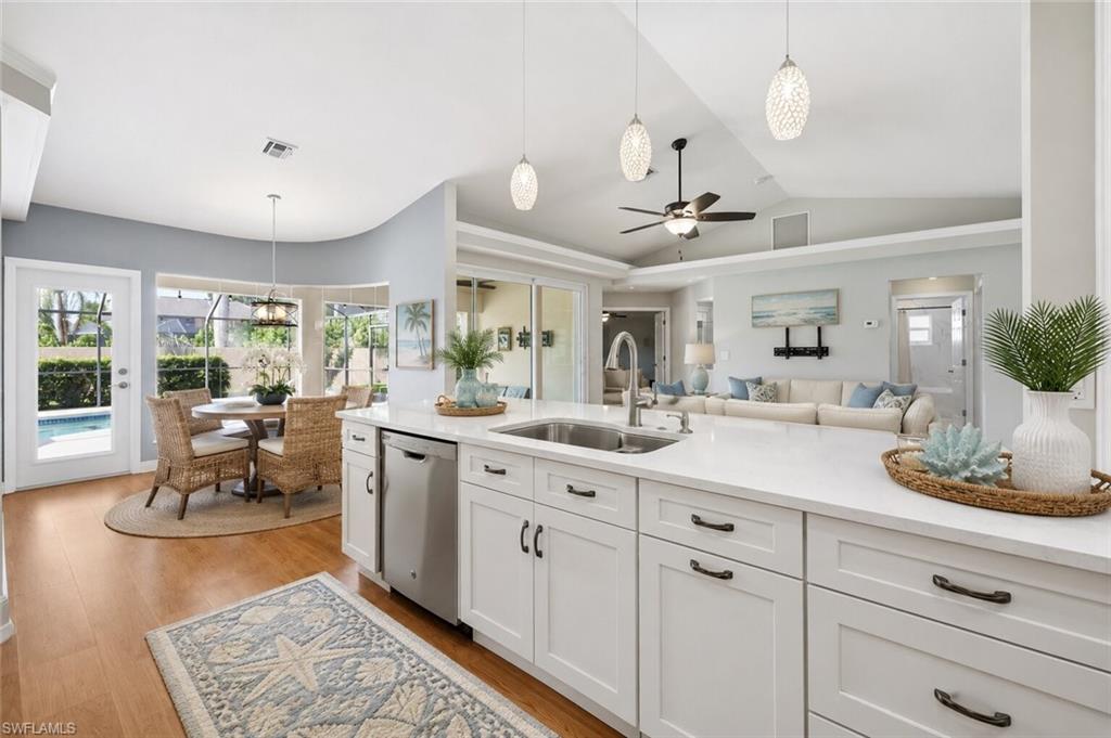 Updated kitchen with Quartz countertops and stainless appliances, decor and furniture is AI generated, kitchen is full updated as seen