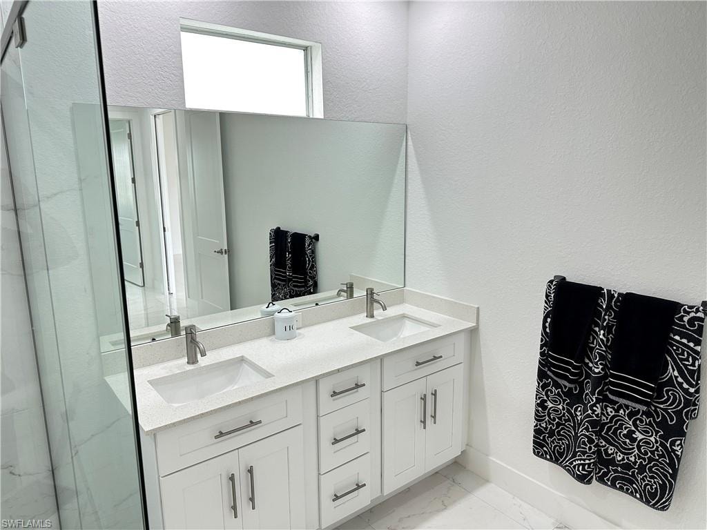 Dual vanity with under-mount sinks, quartz countertop, and brushed nickel faucets