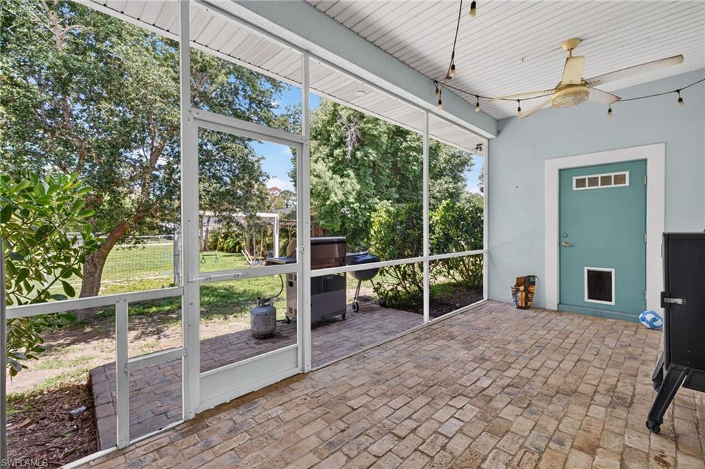 Patio that leads to the backyard with a firepit